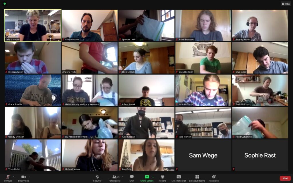 A screenshot of a zoom screen. Professor Connole teaches in the upper left corner, and students are concentrated on making their pinch pots. 