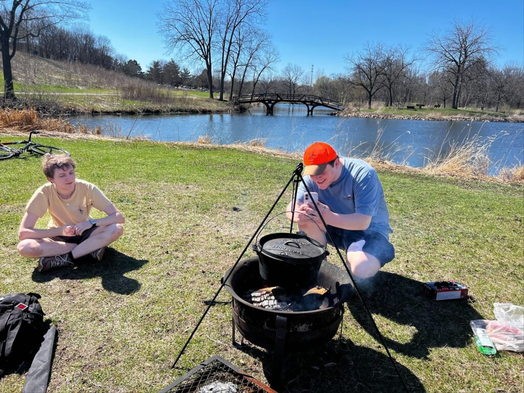 The group looking over the cheese curds for the Ricotta. people in the pitcher are Clark the one in a yellow shirt and Chance with the bright orange hat closest to the fire. 